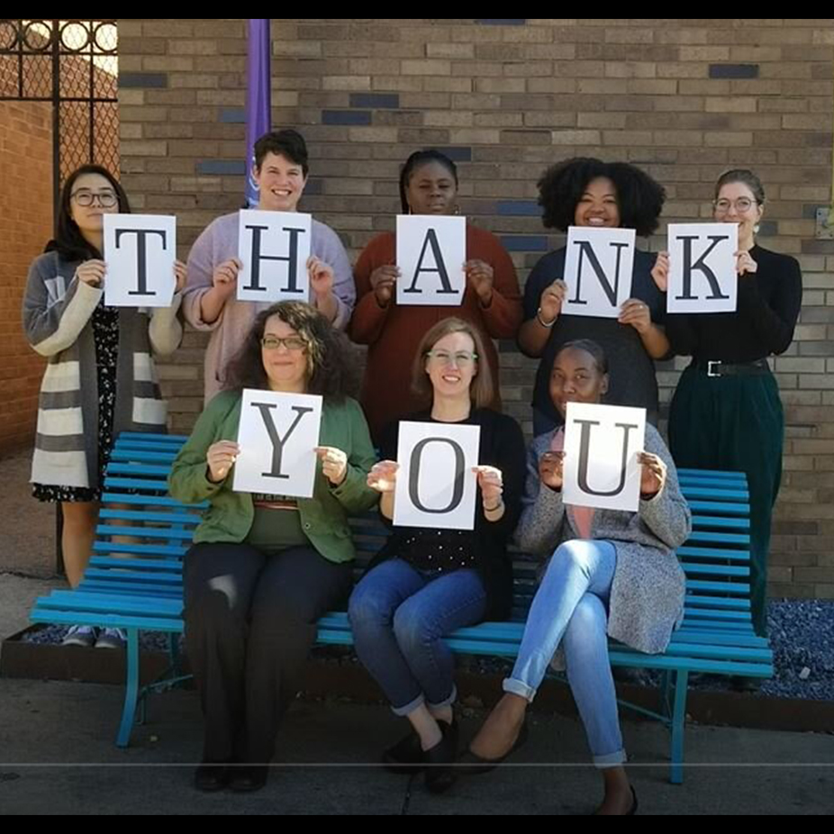 Team holding up Thank you Sign