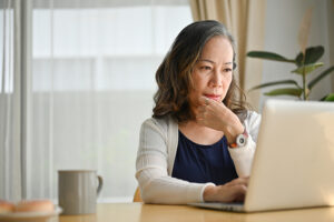 Woman looking at laptop
