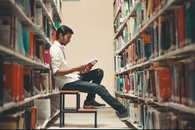 Student in Library, student debt, student loan repayment