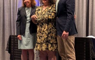 Photo of Marceline White receiving an award