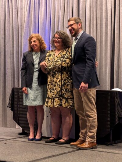 Photo of Marceline White receiving an award